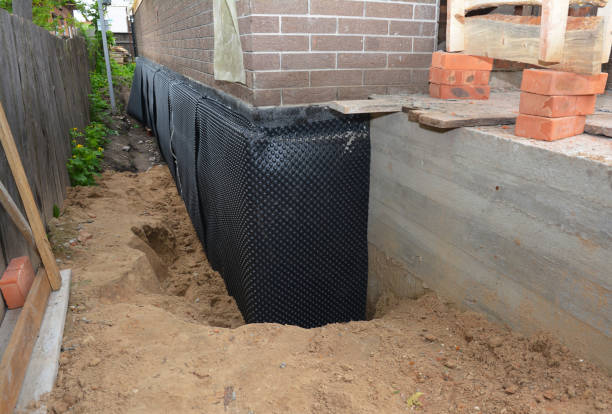 Happy homeowners after waterproofing job in Culver